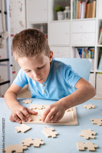 boy playing puzzle