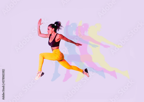 Sportive woman running on white background