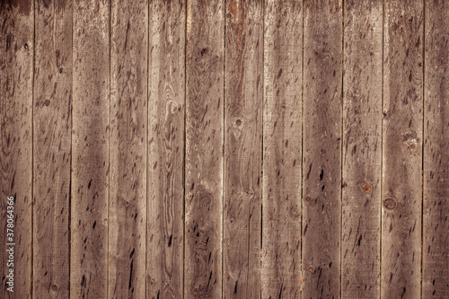Wood BackgroundDark brown background of wooden boards as a blank for a postcard or a template for a design layout with a place for text