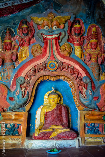 Ancient colorful statue of the Buddha in Ravana Temple near Ella town on the island of Sri Lanka © Sergey