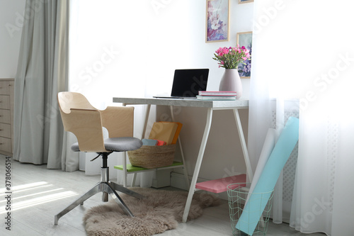 Comfortable workplace with office chair and modern table © New Africa