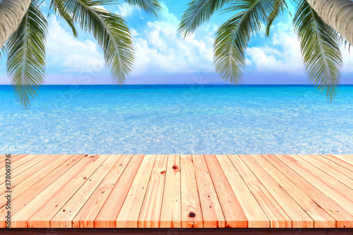 Wooden floor or plank on sea in summer. For product display.Calm Sea and Blue Sky Background.
