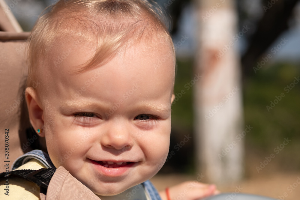 Close-up portrait of an infant, little child. Smiling baby girl. Close-up portrait of an infant, little child. Smiling baby girl.