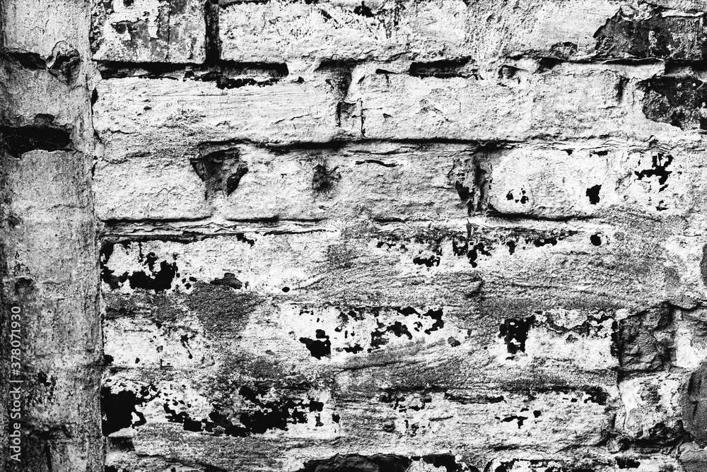 Obraz premium Texture of a brick wall with cracks and scratches which can be used as a background