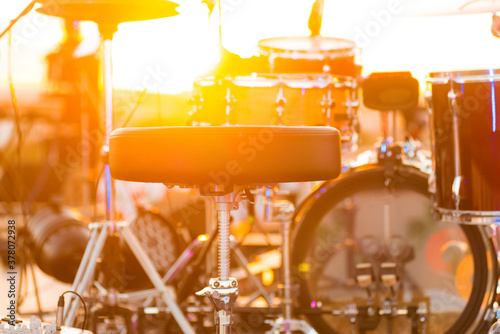 Sticker Close up photo of drum set on stage during sunset, live jazz performance