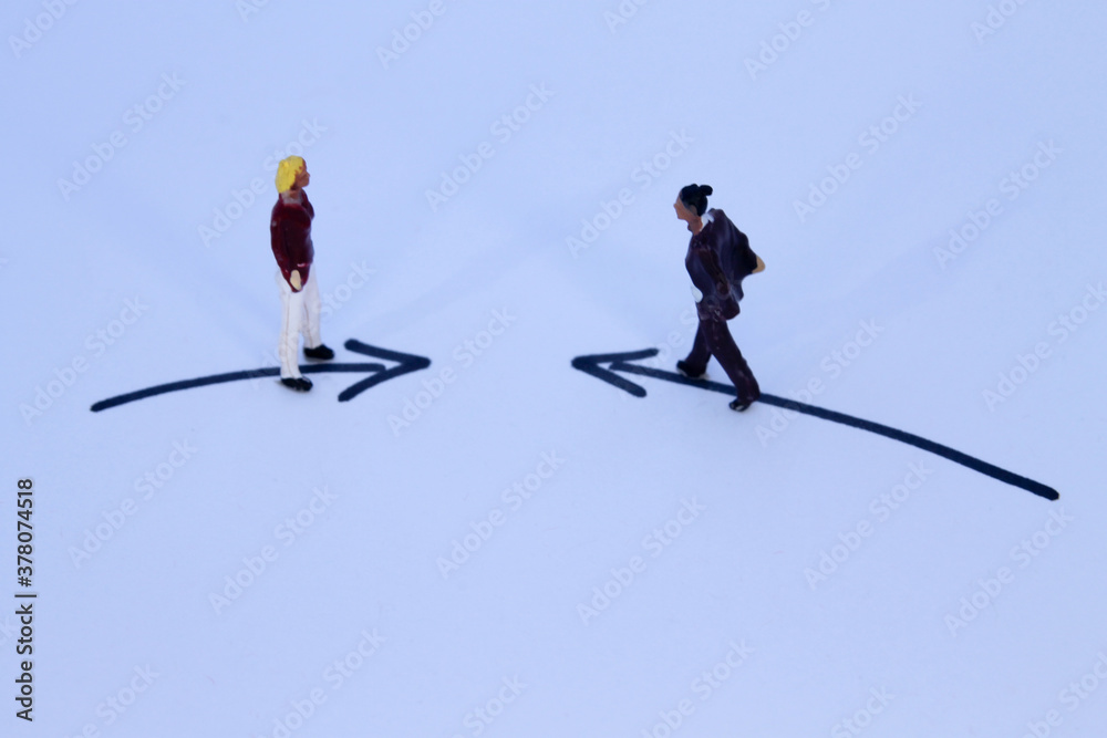 two miniature figures approach each other two miniature figures approach each other