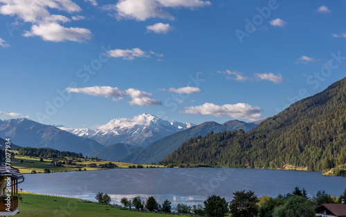 Superb panoramic view of Lago della Muta with the snowy Mount Ortles in the background, South Tyrol, Italy photo