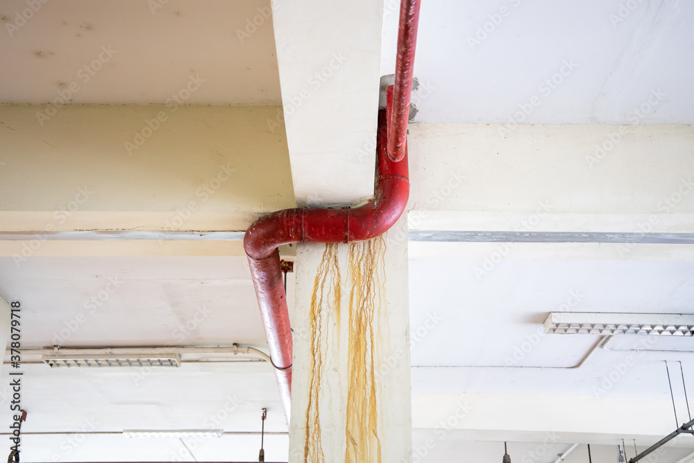 Sewage water leakage from pipeline in the building. Dirty wall from a