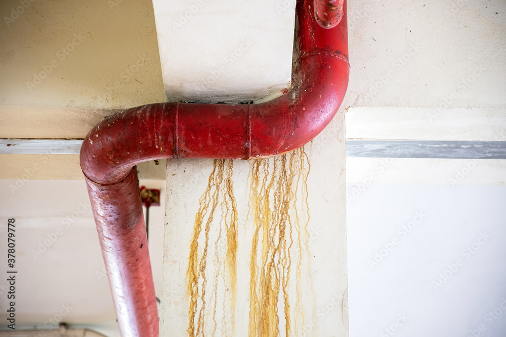 Sewage water leakage from pipeline in the building. Dirty wall from a