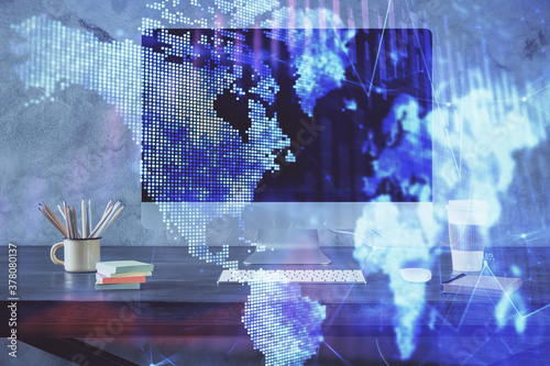 Financial chart drawing and table with computer on background. Double exposure. Concept of international markets.