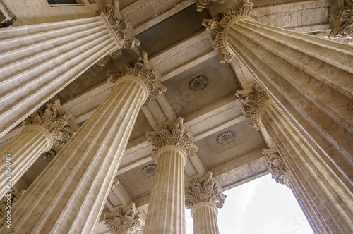 Vintage Old Justice Courthouse Column. Neoclassical colonnade with corinthian columns as part of a public building resembling a Greek or Roman temple