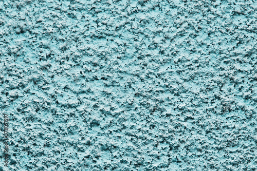 Blue paint stucco wall texture. Concrete surface background. Color plaster wall pattern. Distressed backdrop for graphic design.