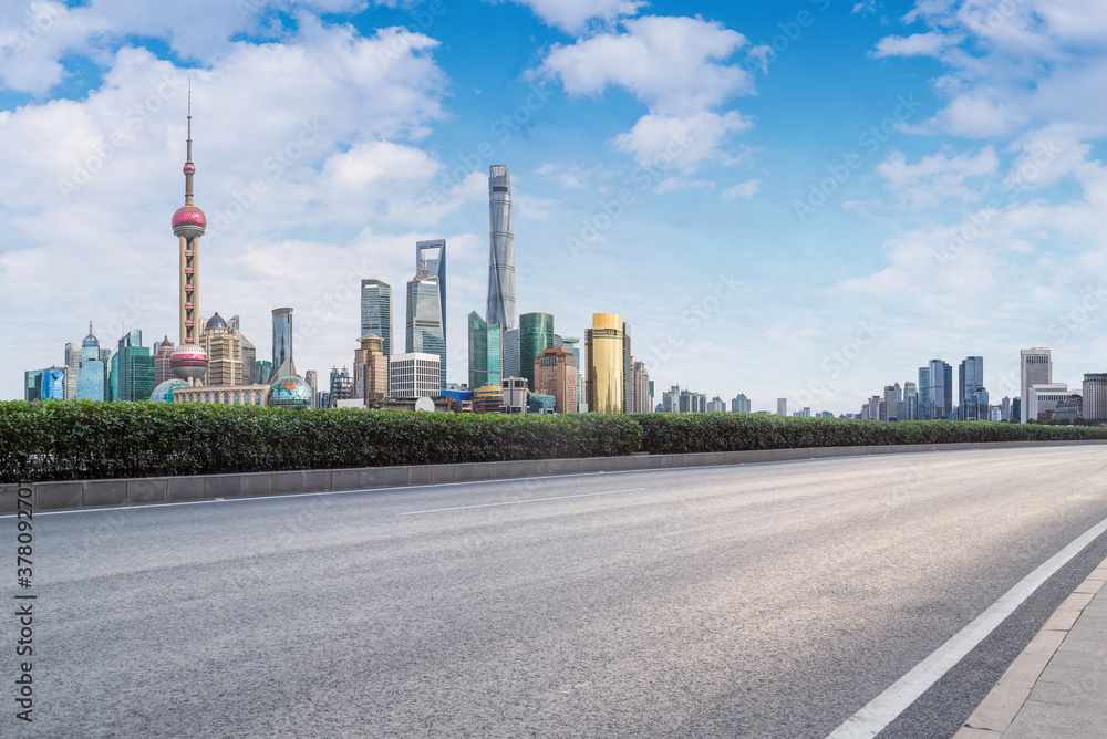 city skyline of shanghai, with empty asphalt road. city skyline of shanghai, with empty asphalt road.