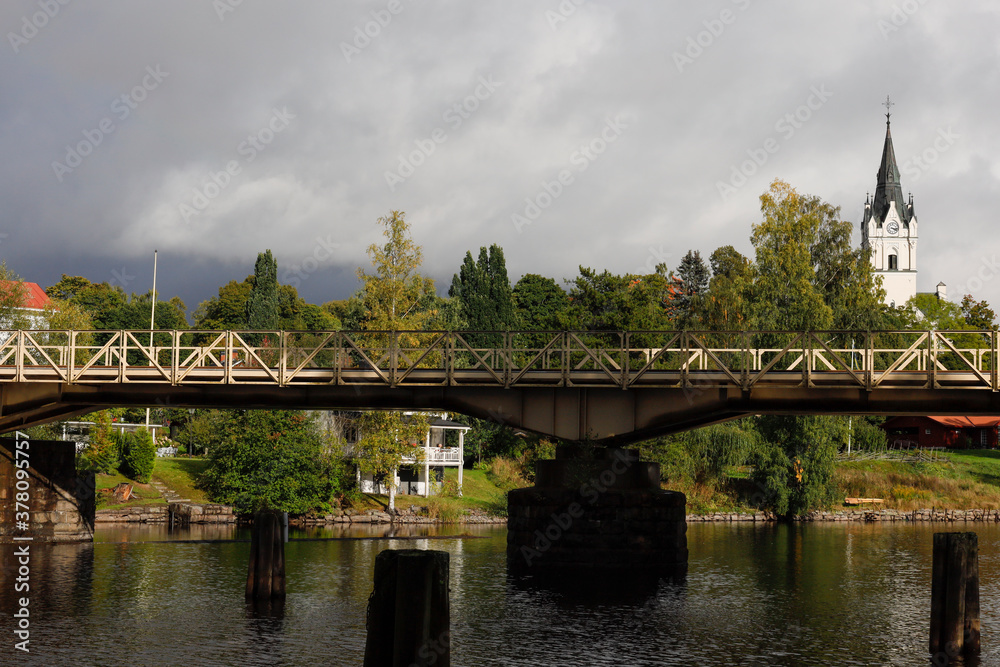 Sunne, Sweden Sept 11, 2020 A train bridge and church over the river. Sunne, Sweden Sept 11, 2020 A train bridge and church over the river.