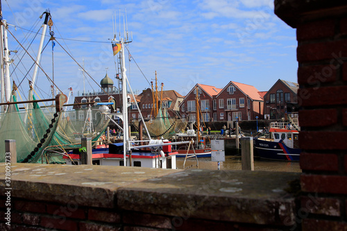 Neuharlingersiel mit Fischereihafen. Nordsee, Krabbenfang , Hafen, UNESCO Weltkultgurerbe, Ostfriesland, Niedersachsen, Deutschland, Europa photo