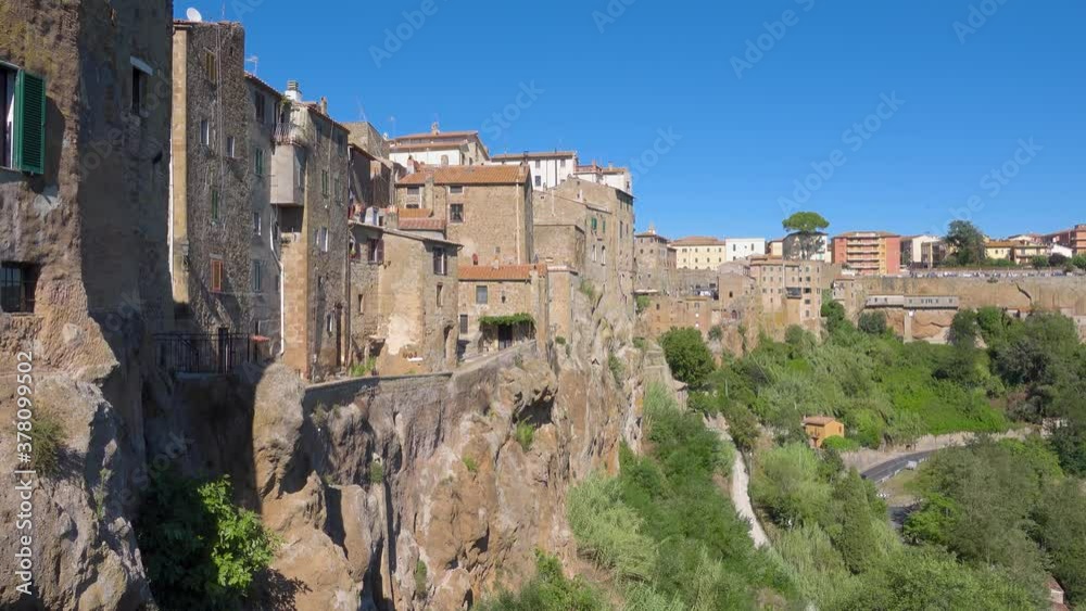 Pitigliano, Tuscany perched on tuff cliff, Old Town and alleys. Splendid town in the Tufo Area, in the heart of Tuscan Maremma, Pitigliano perched on tuff cliff one of most beautiful villages in Italy Pitigliano, Tuscany perched on tuff cliff, Old Town and alleys. Splendid town in the Tufo Area, in the heart of Tuscan Maremma, Pitigliano perched on tuff cliff one of most beautiful villages in Italy