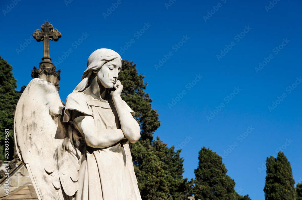 Obraz premium Angel statue at Montjuic Cemetery in Barcelona, Spain