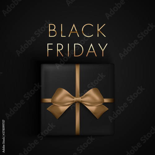 Black Friday Sale present box with gold ribbon bow, view from above. Banner, poster, golden text color on dark background.