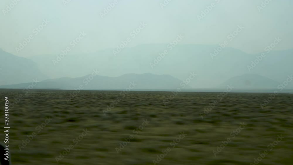 Driving past morning mists over a mountain range in the western United States. Driving past morning mists over a mountain range in the western United States.