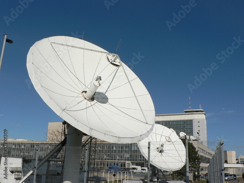 Headquarters of Czech Television - public broadcaster  provider of TV channel for education  culture  fun and information. Large satellite dish in the blue sky.