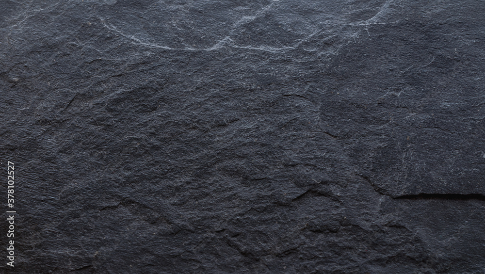 Naklejka premium natural dark stone texture close up, empty copy space background