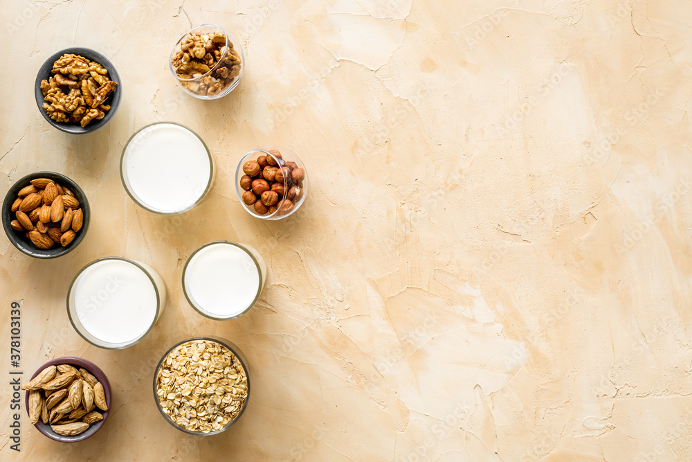 Vegan alternative nuts milk in bottles. Above view Vegan alternative nuts milk in bottles. Above view