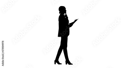 Silhouette Serious Businesswoman reading report preparing for a
