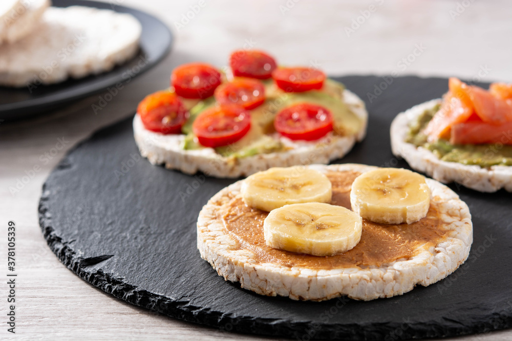 Assortment Puffed rice cake snack on white wooden table