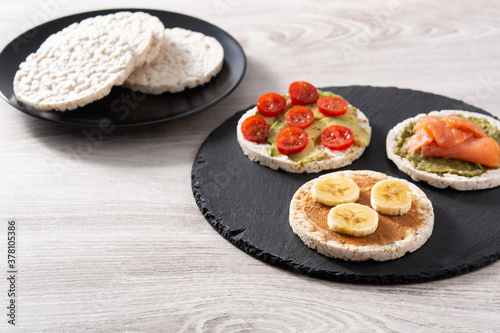 Assortment Puffed rice cake snack on white wooden table