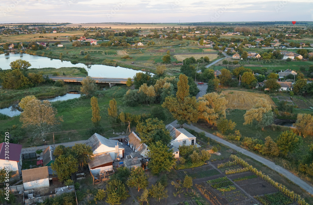 Top view of the village in the rays of the setting sun