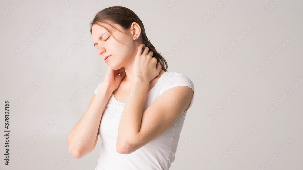 Tired woman feeling pain, massaging tense muscles