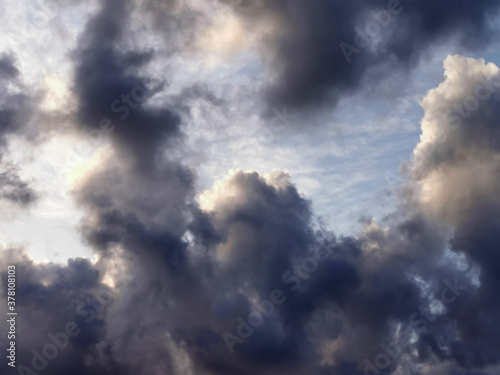 Storm clouds on clear sky