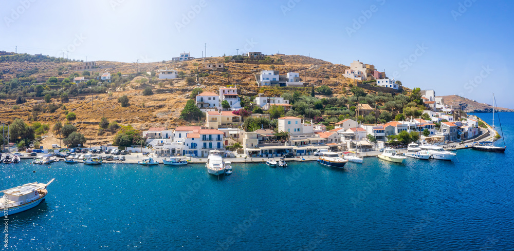 The small village of Vourkari on the island of Tzia, Kea, Greece, with moored yachts and sailboats in the Marina