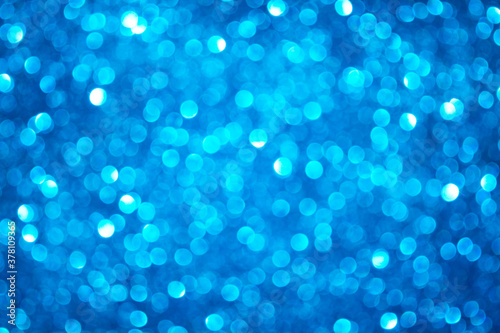 de focused background with blue glitter, bokeh with glitter