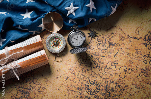 Happy Columbus Day concept. Vintage American flag with compass and retro treasure manuscript.  Flat lay, top view with copy space.