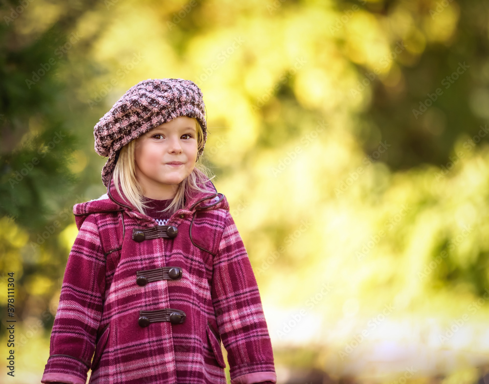 Little blonde girl posing in coat in autumn Little blonde girl posing in coat in autumn