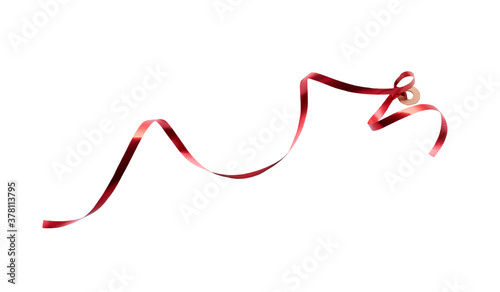 Obraz na płótnie A thin curly red ribbon for Christmas and birthday present tag loop isolated against a white background. w salonie