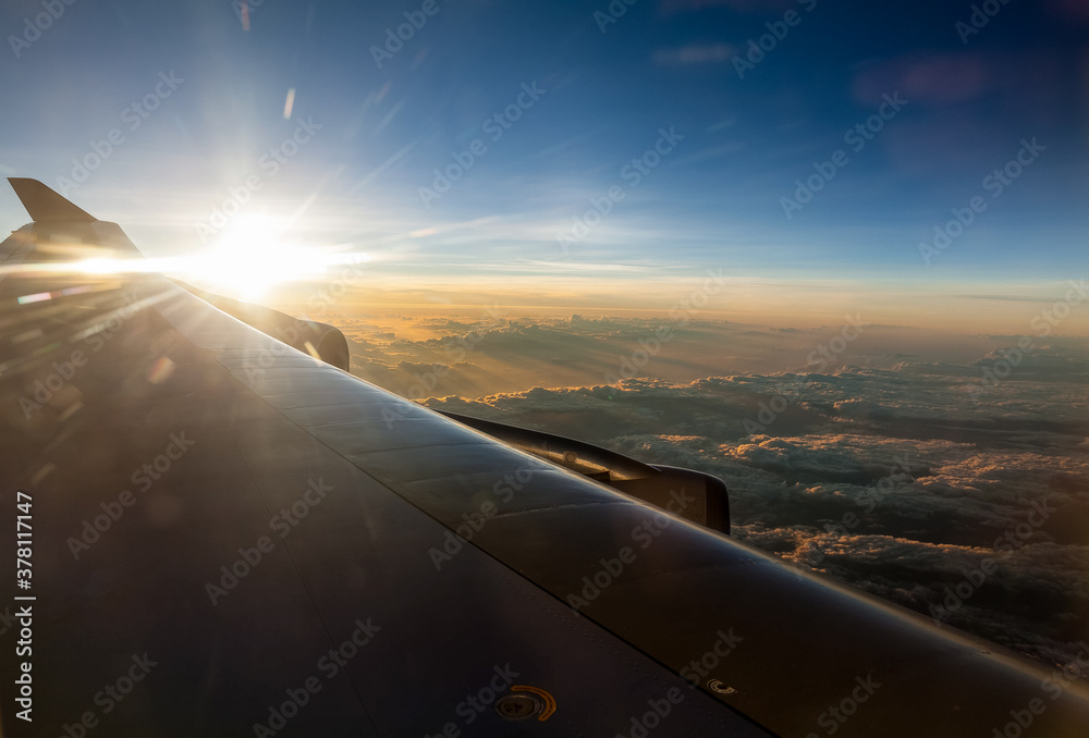 Sunset from a jumbo jet flying over the South Pacific Ocean on a long haul flight. Sunset from a jumbo jet flying over the South Pacific Ocean on a long haul flight.