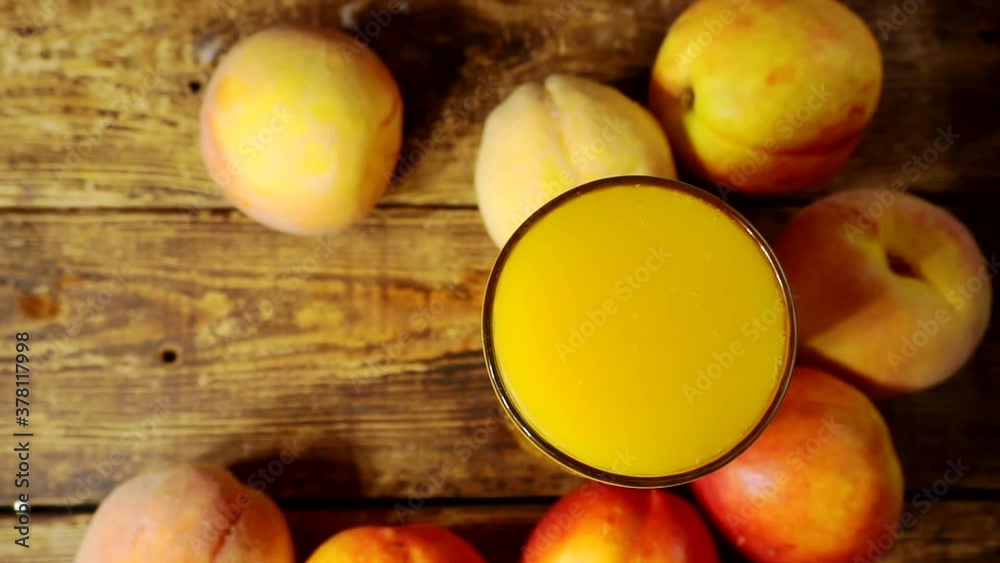 still life with fresh fruit.ripe peaches and a glass full of peach juice still life with fresh fruit.ripe peaches and a glass full of peach juice