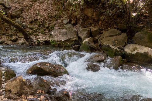 The bed  of the swift mountainous Hermon River with crystal clear waters in the Golan Heights in northern Israel