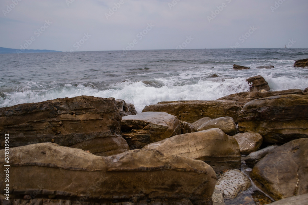 waves crashing on rocks