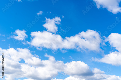 Blue sky with clouds. Typical midday sky