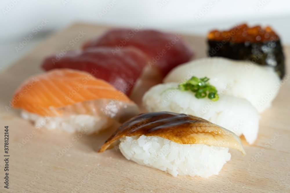 Japanese dish Sushi on wooden plate Japanese dish Sushi on wooden plate