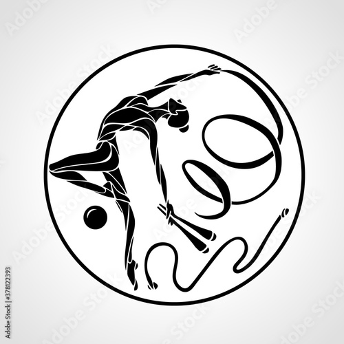 gymnastic girl in a circle with hoop, clubs, a ribbon, skipping rope and a ball