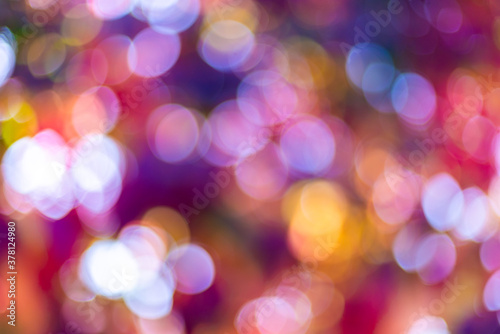 Autumn natural bokeh for background. Defocused abstract autumnal backdrop in yellow, red, orange and purple tones. Copy space. Space for text