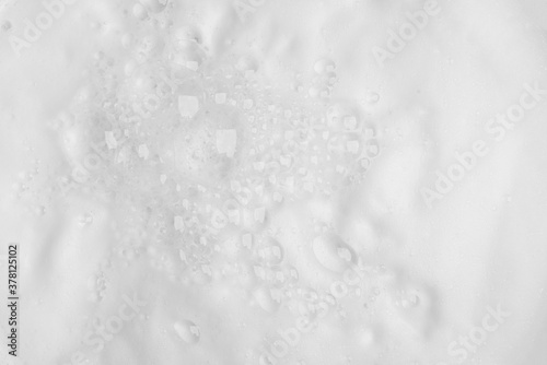 Bubble foam from soap or shampoo on top view texture background
