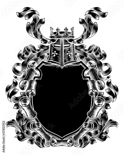 A royal coat of arms scroll shield crest with a knights helmet and crown