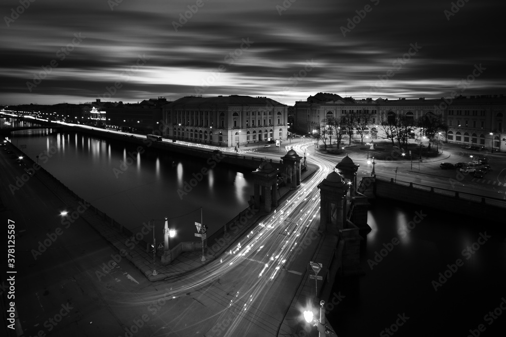 Long exposure cityscape of Fontanka river and Lononosov bridge, Saint-Petersburg, Russia, black and white