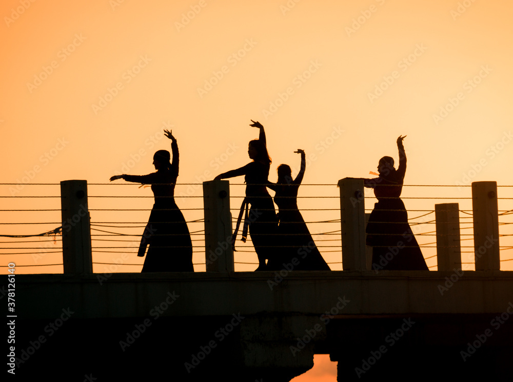 Georgian dancing on the pier in sunset