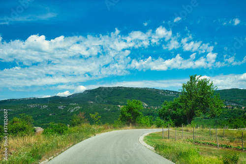 Scenic countryside road across the green hills of Istria, Croatia
